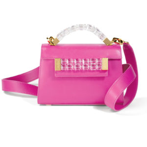 Front view of Mini Jewel Top Handle handbag in fuchsia pink Italian leather with clear Swarovski crystals and yellow gold hardware on top handle and front plaque, and yellow gold clasp on matching pink detachable shoulder strap.