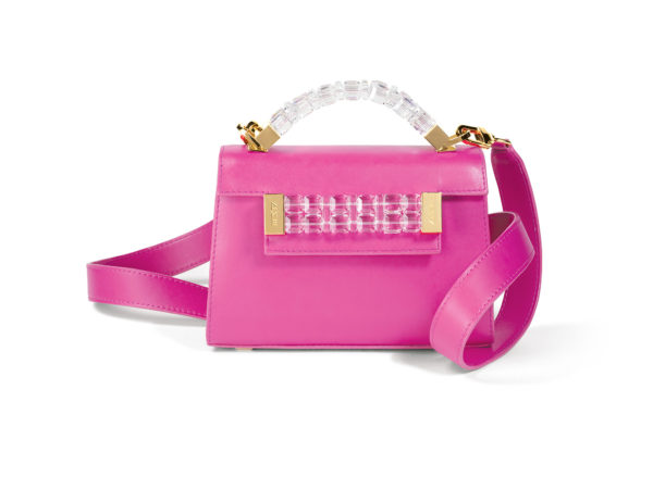 Front view of Mini Jewel Top Handle handbag in fuchsia pink Italian leather with clear Swarovski crystals and yellow gold hardware on top handle and front plaque, and yellow gold clasp on matching pink detachable shoulder strap.